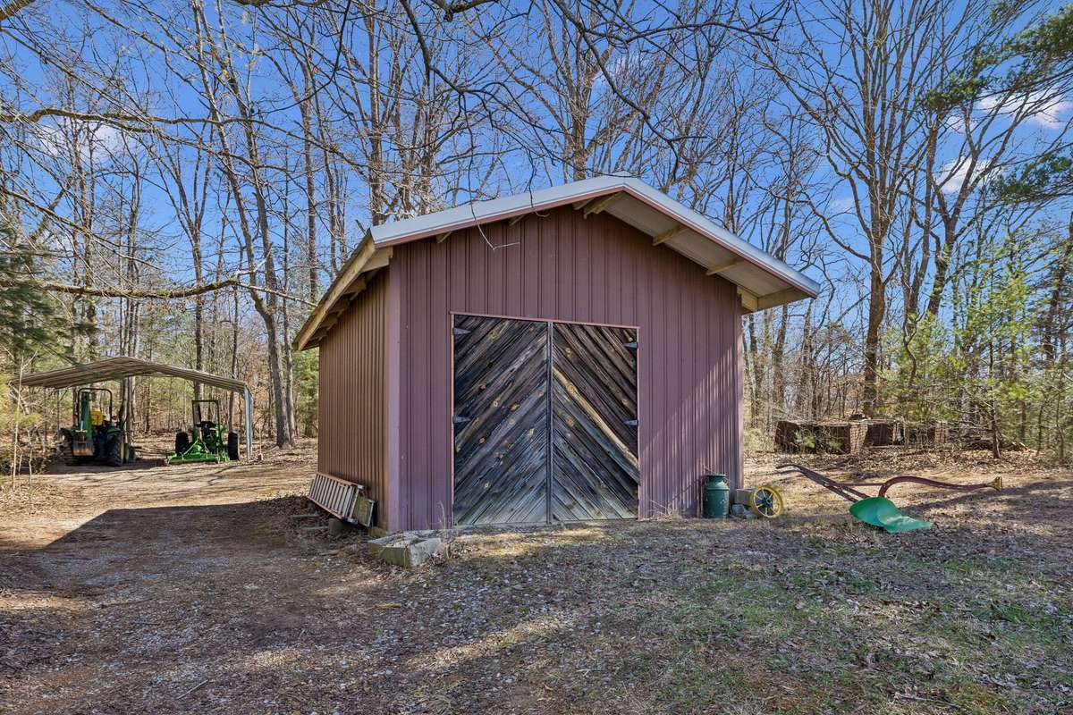 Property complete with 16x20 storage shed with concrete floor, 220V electric, & water plus multiple carports providing weather protection for cars or equipment! 1372 Short Mountain Rd, McMinnville, TN 37110