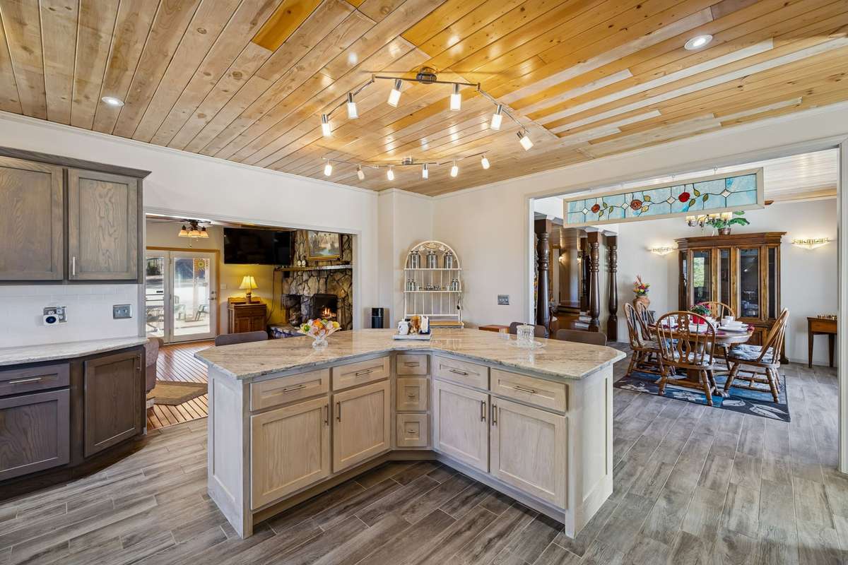 This impressive kitchen has an abundance of cabinetry with soft close doors & drawers plus multiple lazy susans, loads of recessed lighting, and pantry! 1372 Short Mountain Rd, McMinnville, TN 37110