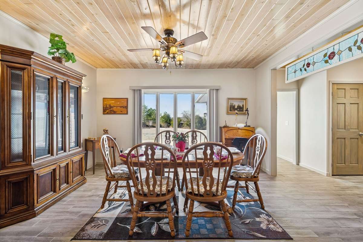 Impressive dining area perfect for family meals or entertaining, with natural light and views of the countryside beyond! 1372 Short Mountain Rd, McMinnville, TN 37110