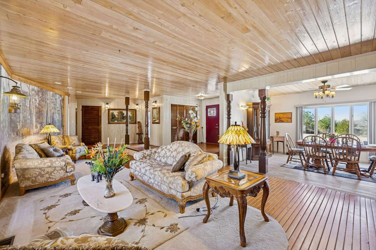 Open-concept layout connecting the living room and dining area, creating an easy flow for everyday living and entertaining! 1372 Short Mountain Rd, McMinnville, TN 37110