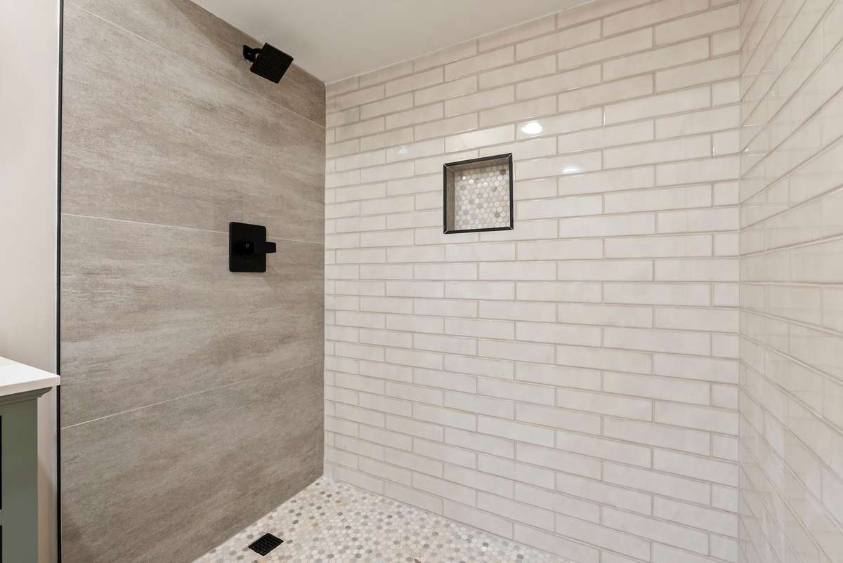 Statement walk-in shower with pebble tiled floor and shampoo niche! 510 Iris Avenue, Murfreesboro, TN 37128