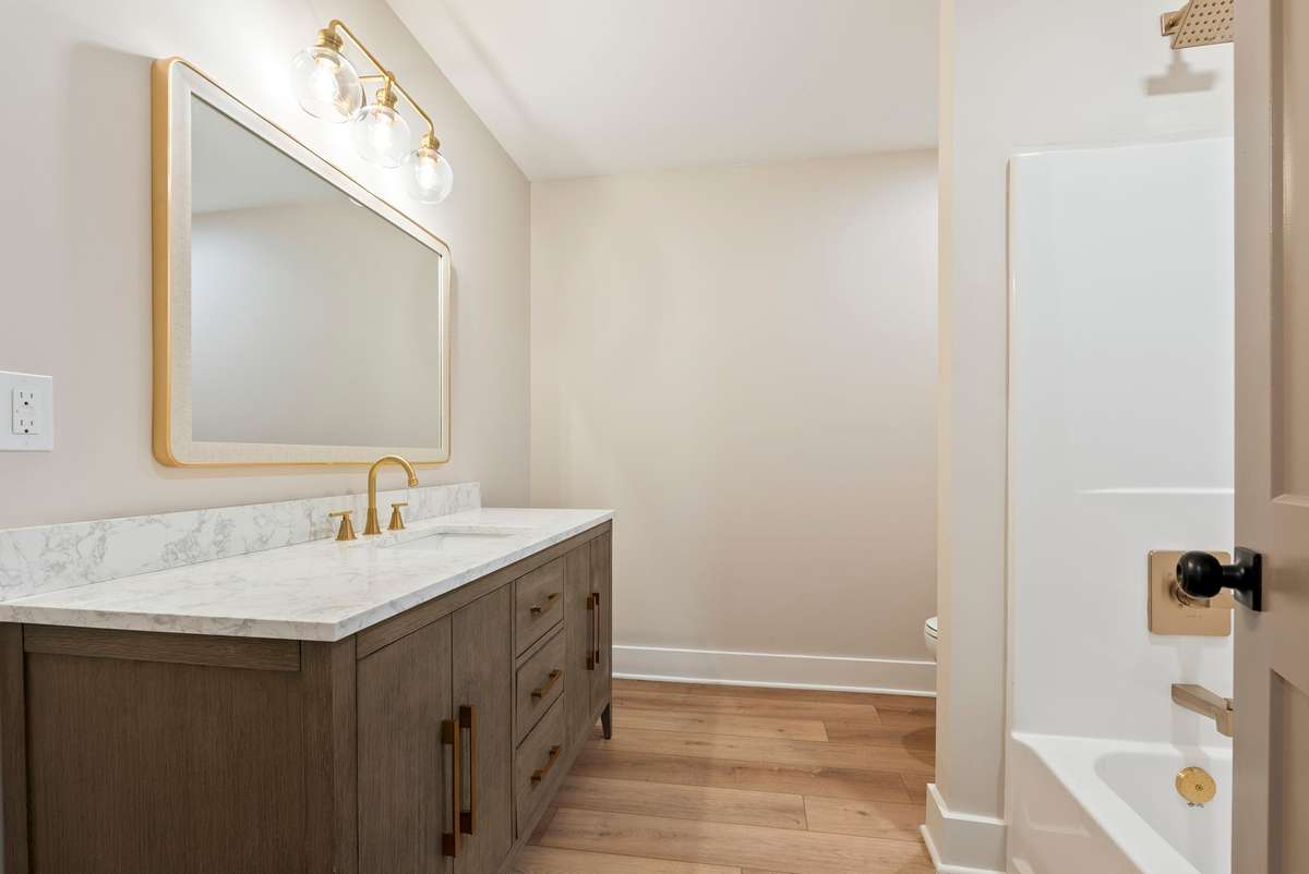 Light and bright upstairs guest bath has understated luxury design that will stand the test of time. 510 Iris Avenue, Murfreesboro, TN 37128