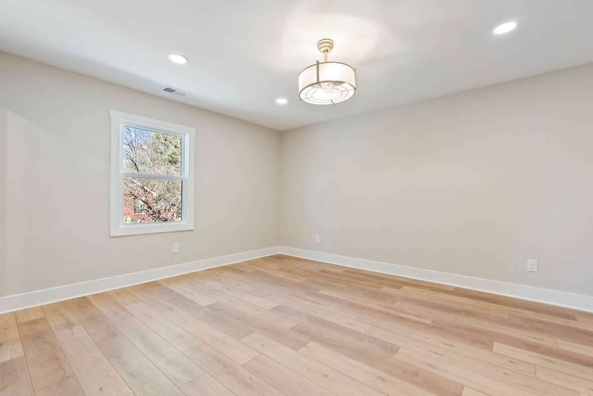 Bedroom 2 upstairs is a generous sized space with oversized closet, extra recessed lighting, and a neutral color palette ready for you to add your own style!  510 Iris Avenue, Murfreesboro, TN 37128