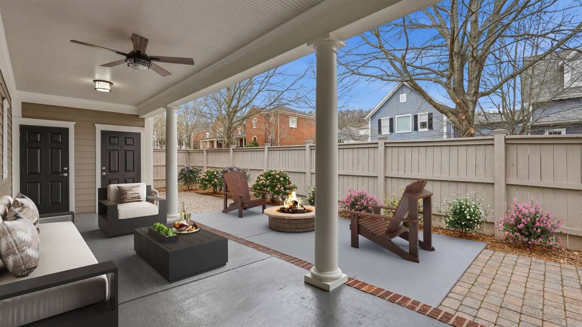 Private courtyard virtually staged - separates main home from garage and guest room (gym or office?) and bath above the garage
