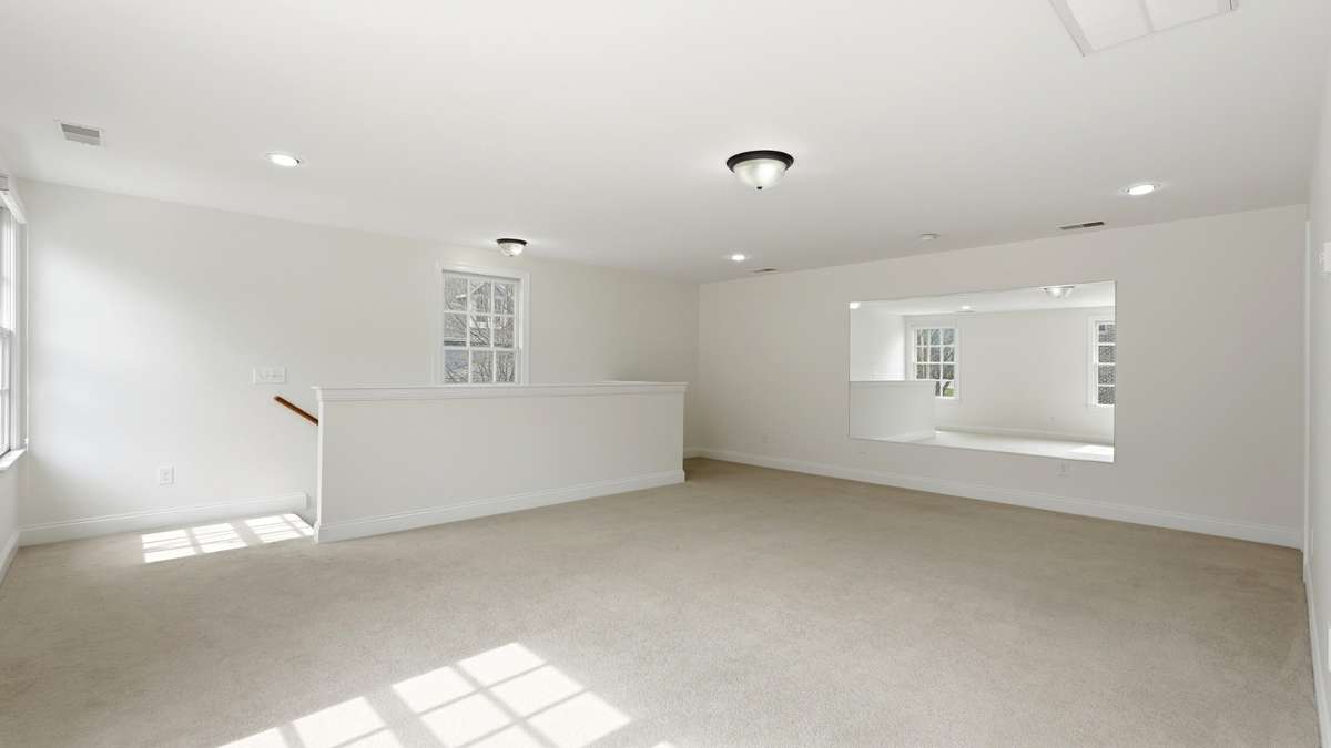 Detached room with closet and bathroom above garage.