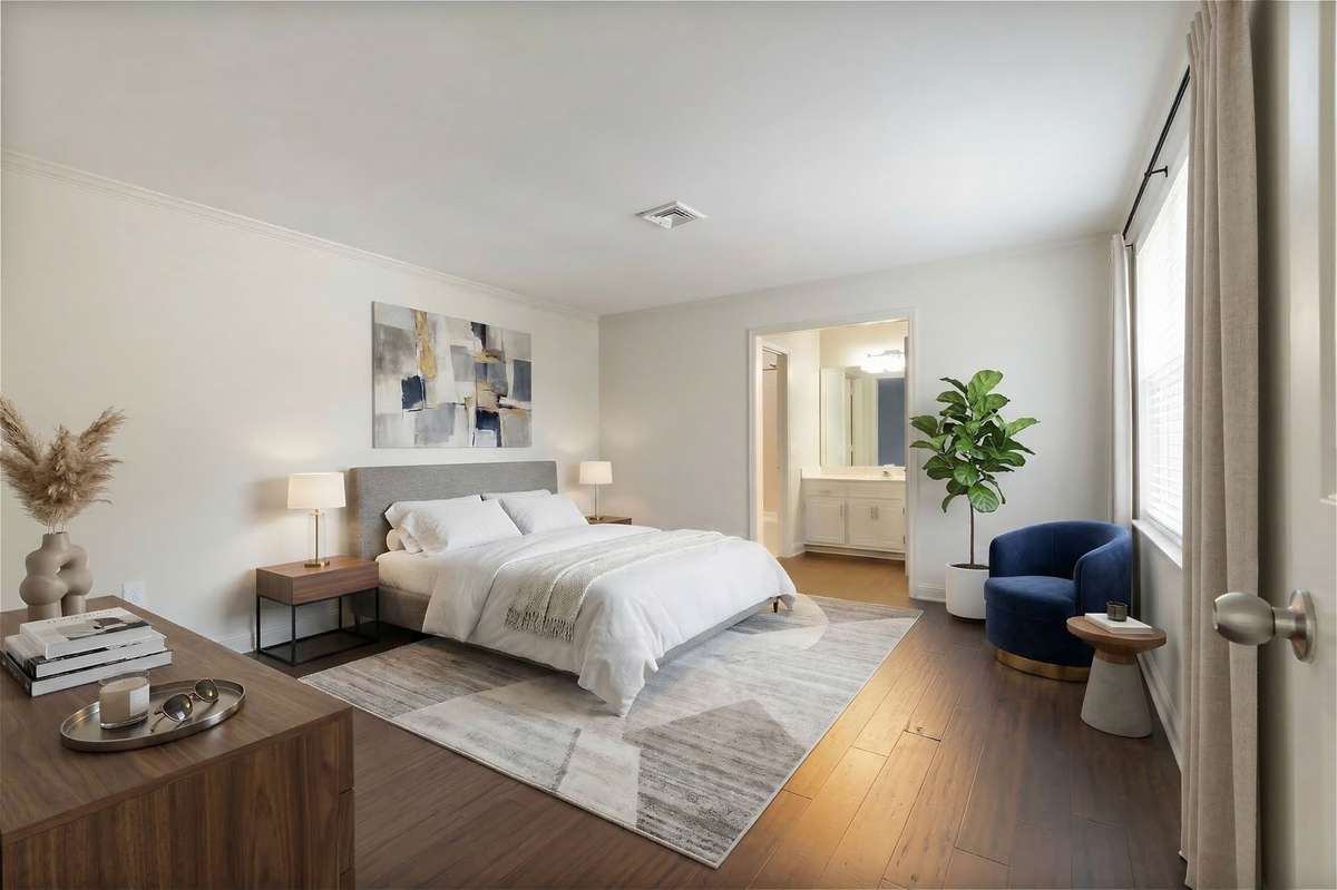 the primary bedroom that has been virtually staged