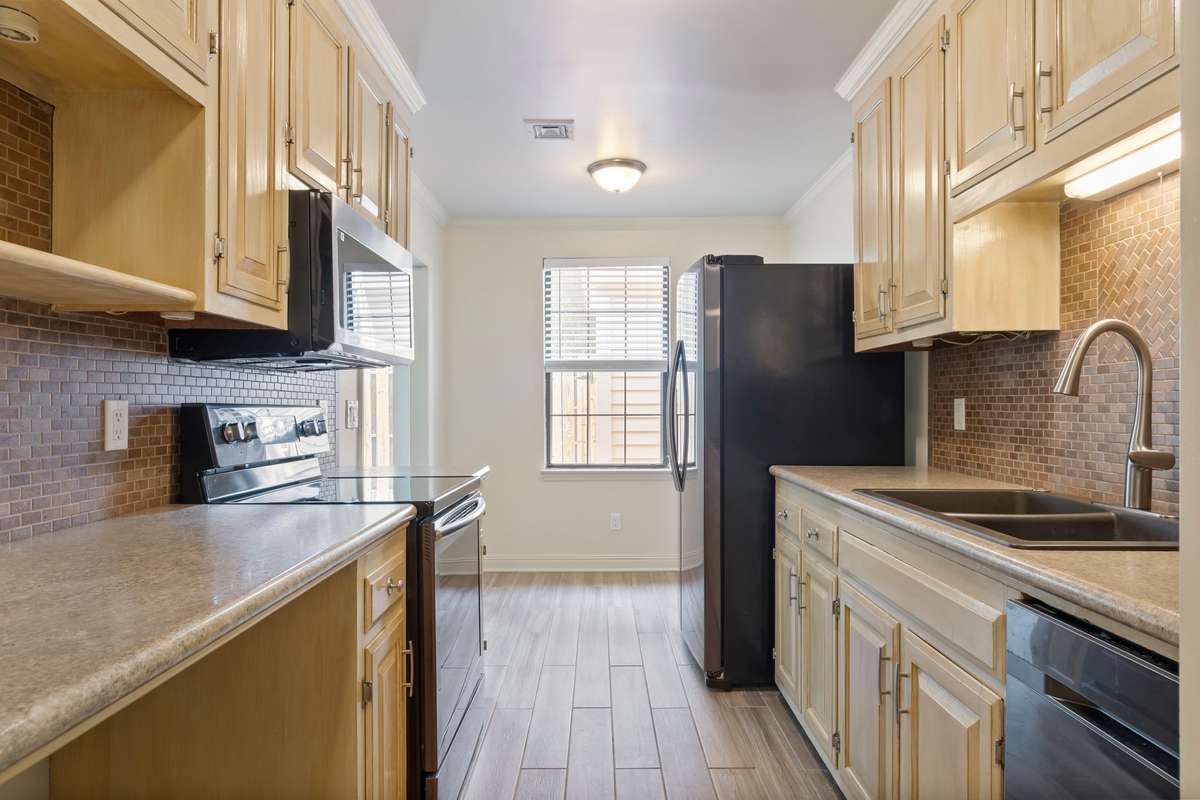 Kitchen with view of back patio