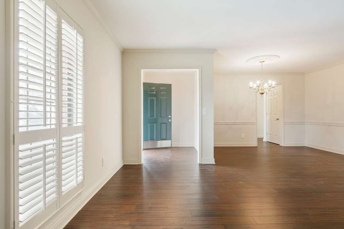 View to foyer, front door, living room looking into Dining area