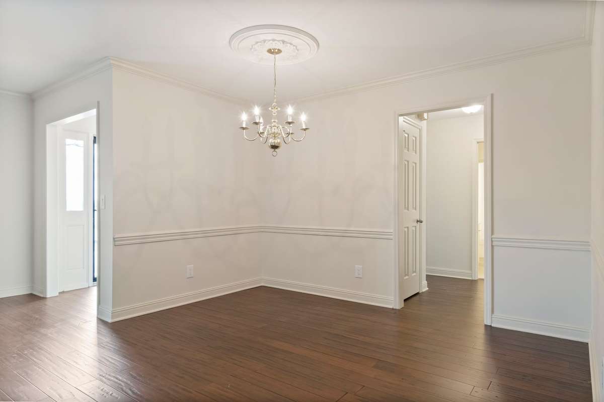 Dining with view to foyer and entrance to secondary bedrooms