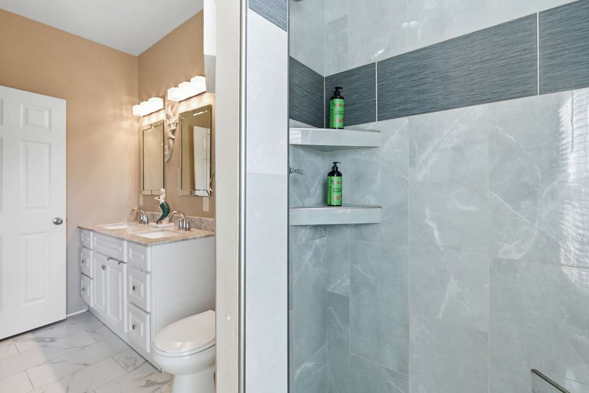 Stand-up shower in the master bedroom