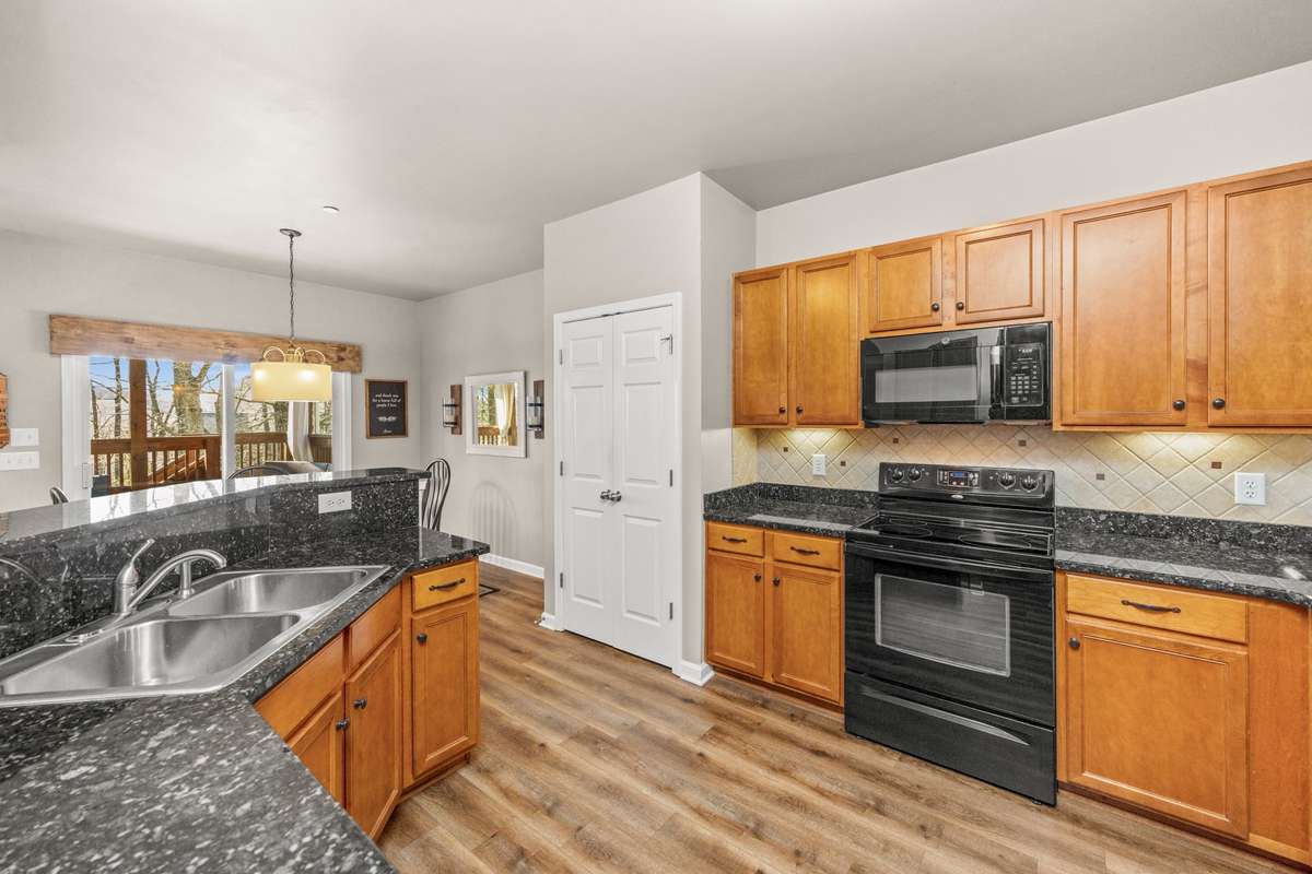 Kitchen with granite countertops and a pantry
