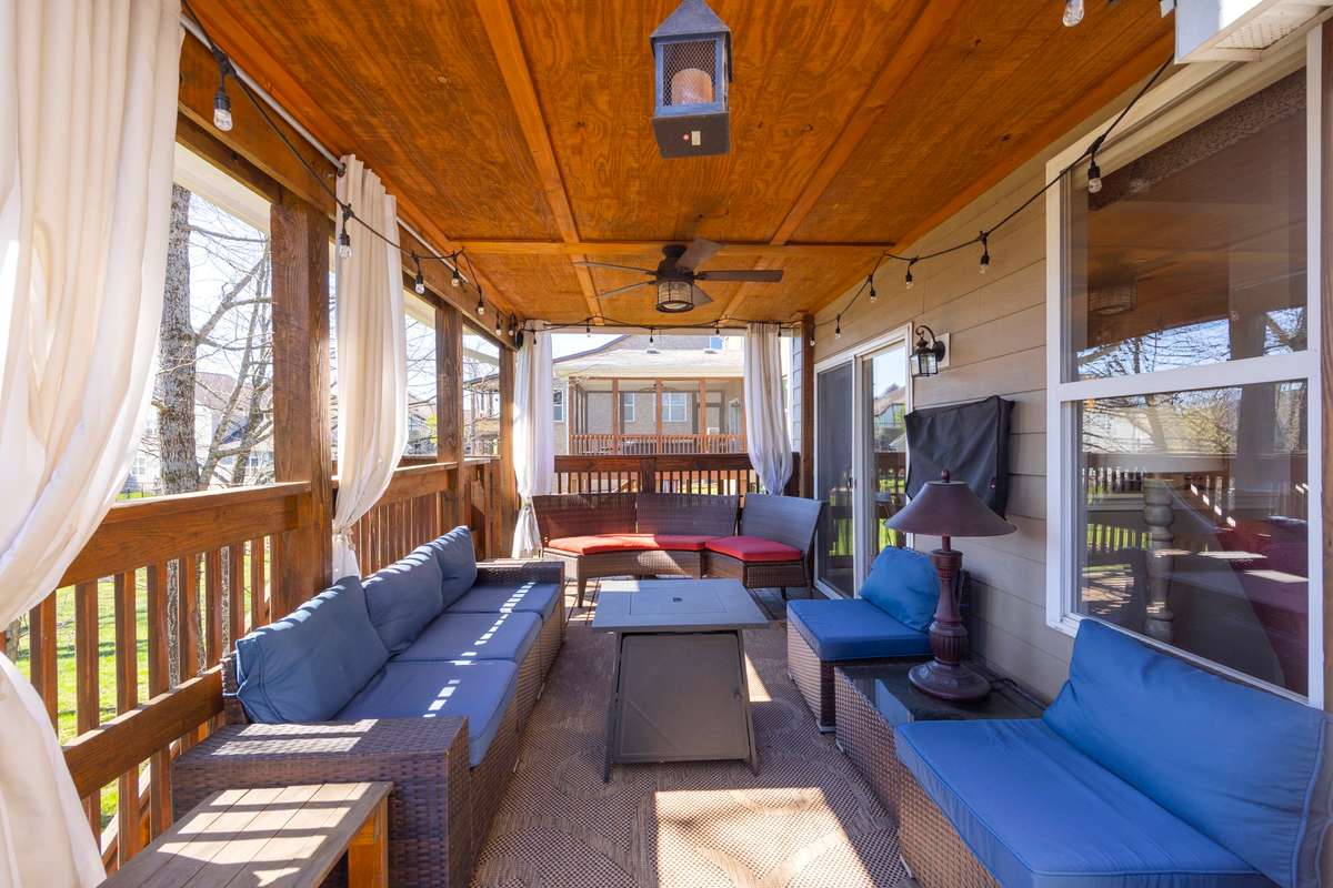 Covered deck with outdoor tv that conveys with the home