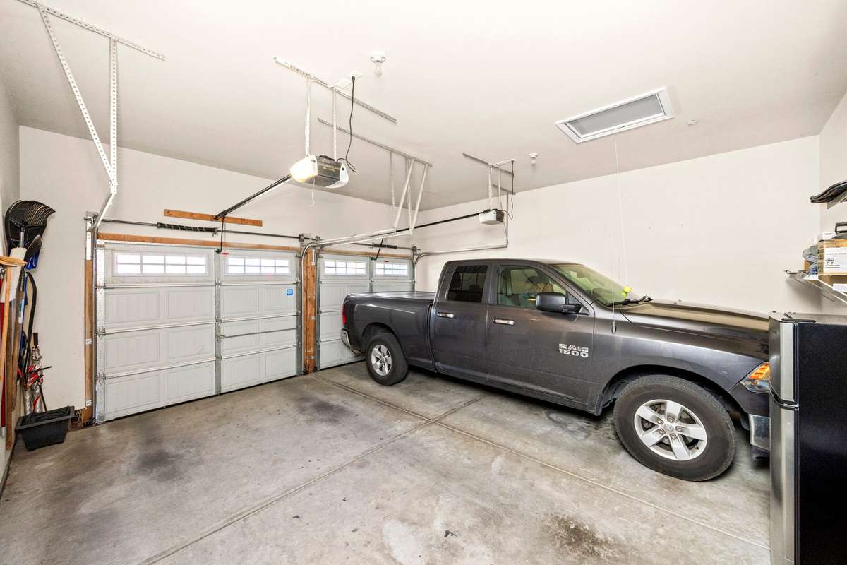 Two car garage large enough for a full size pick up truck and extra storage