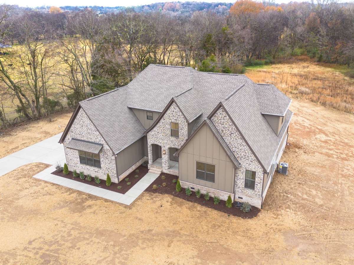 Photo from a previous version of the same plan. Buyer of lot 25 will be able to make selections!