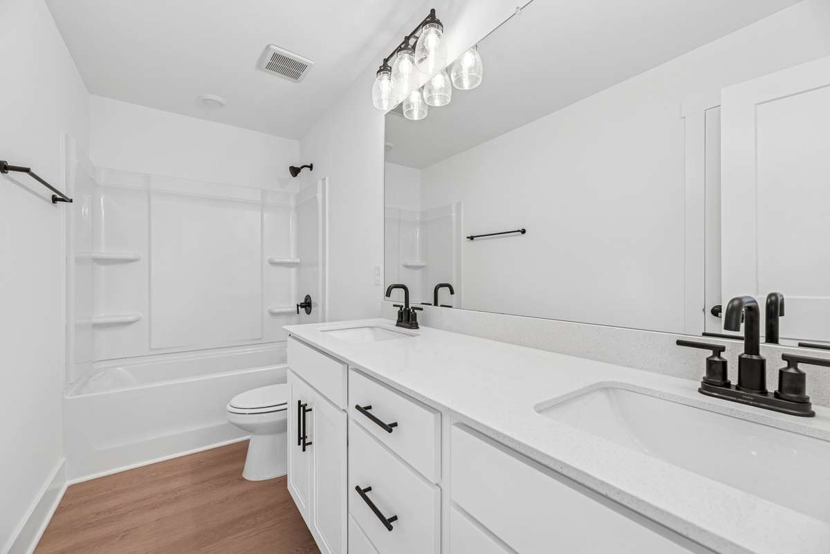 Photos are of a previously built floorplan. Exterior, structural and design options to be chosen during the design appointment after contract.