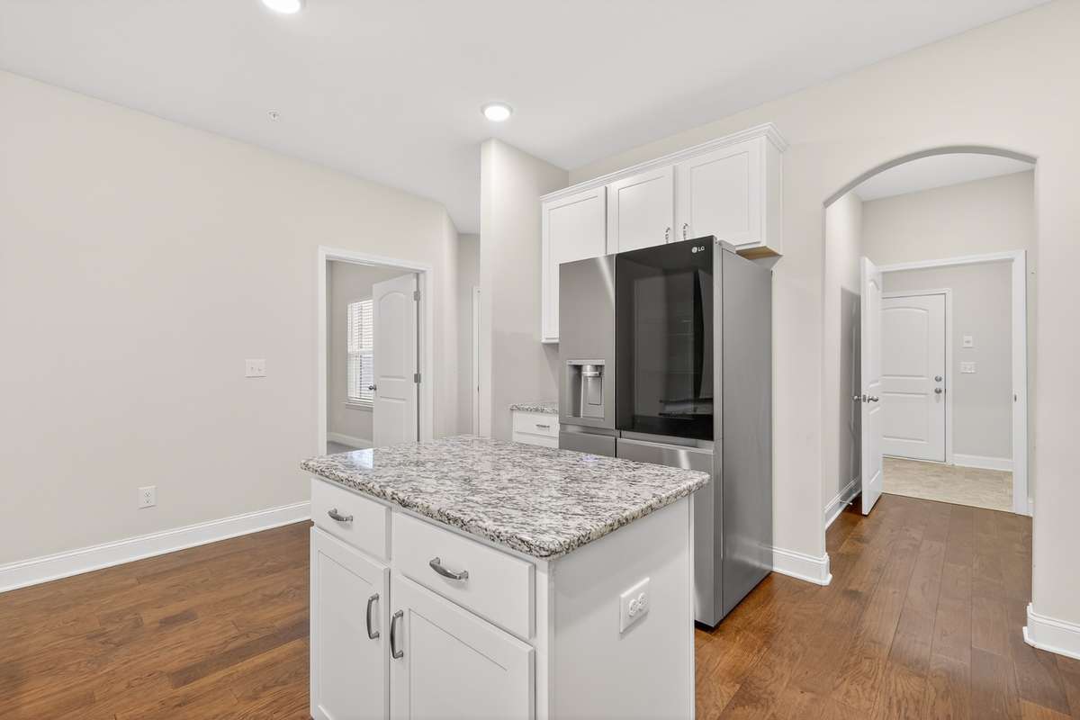 Laundry room, pantry, and lead out to the garage are all just steps away