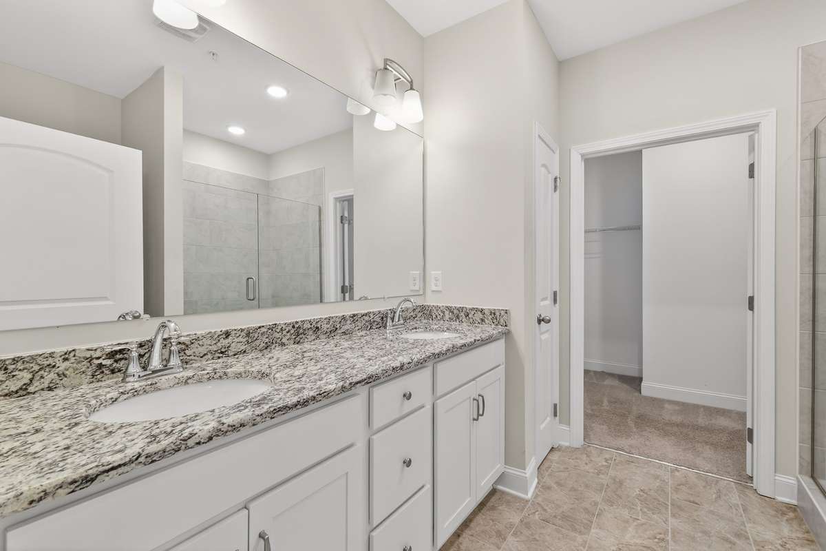 double vanities in owners bath with granite