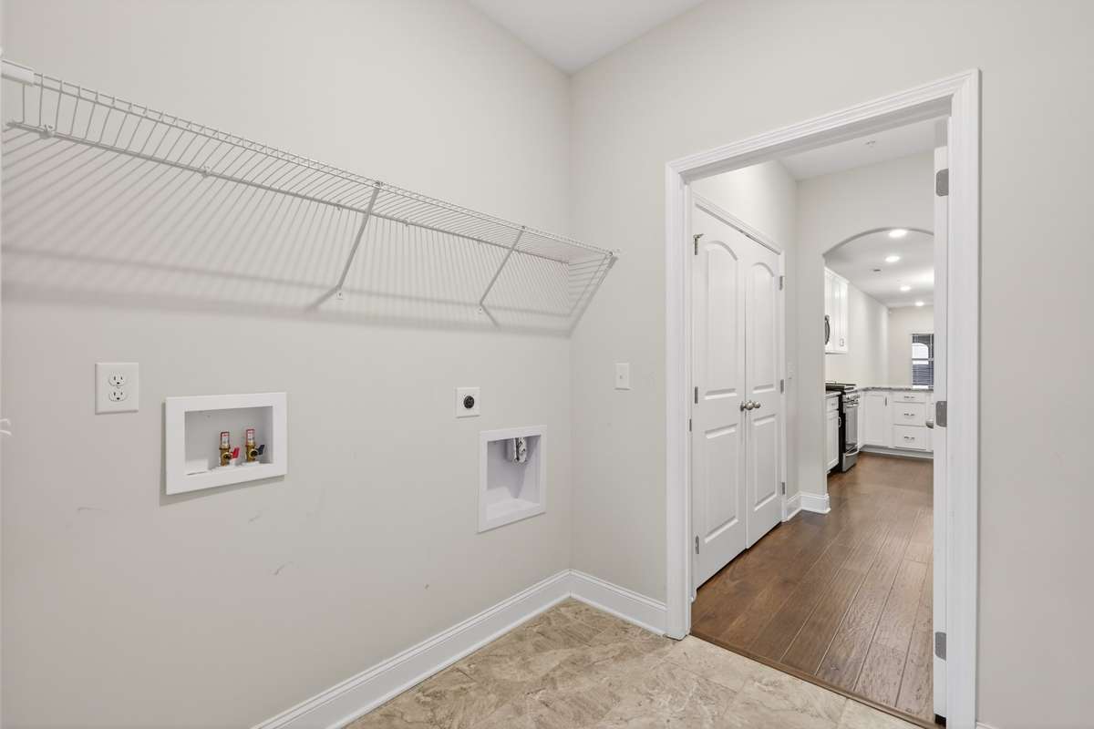 Nice laundry area with storage options