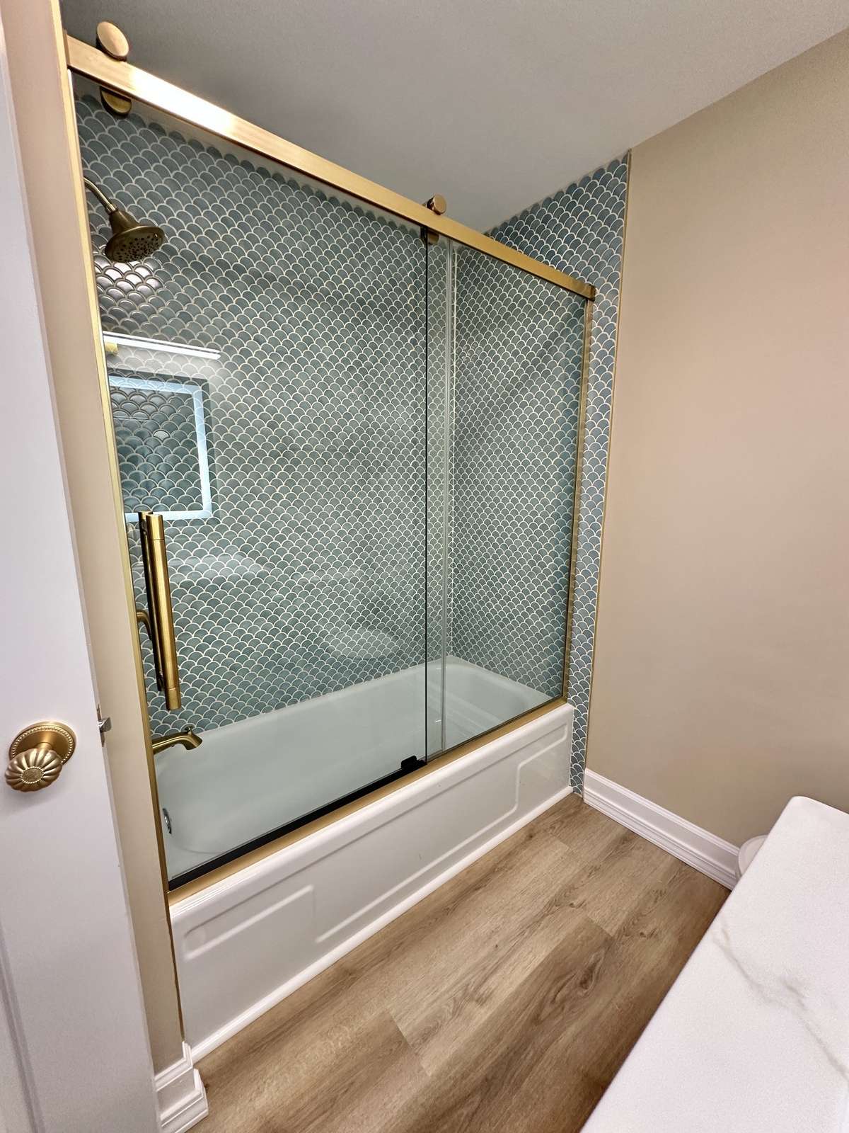 Primary bathroom featuring bathtub.