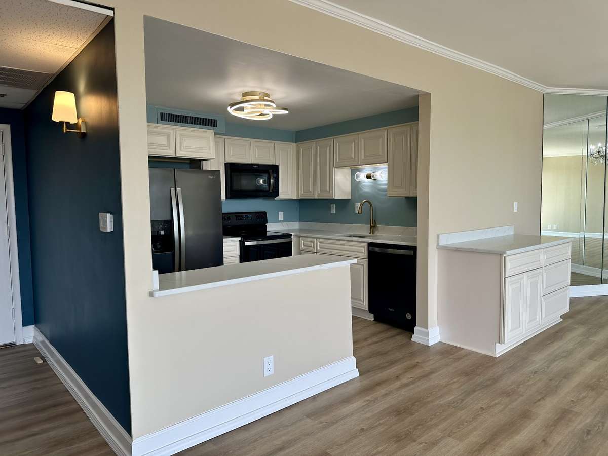 Additional cabinets between the kitchen and dining room add storage. Use as a buffet or coffee