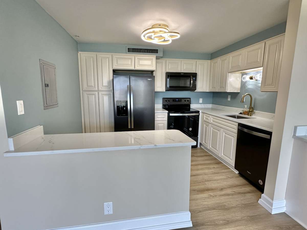 Updated kitchen with plenty of storage. Room for two bar stools tucked to the counter provides additional flexibility in the space.