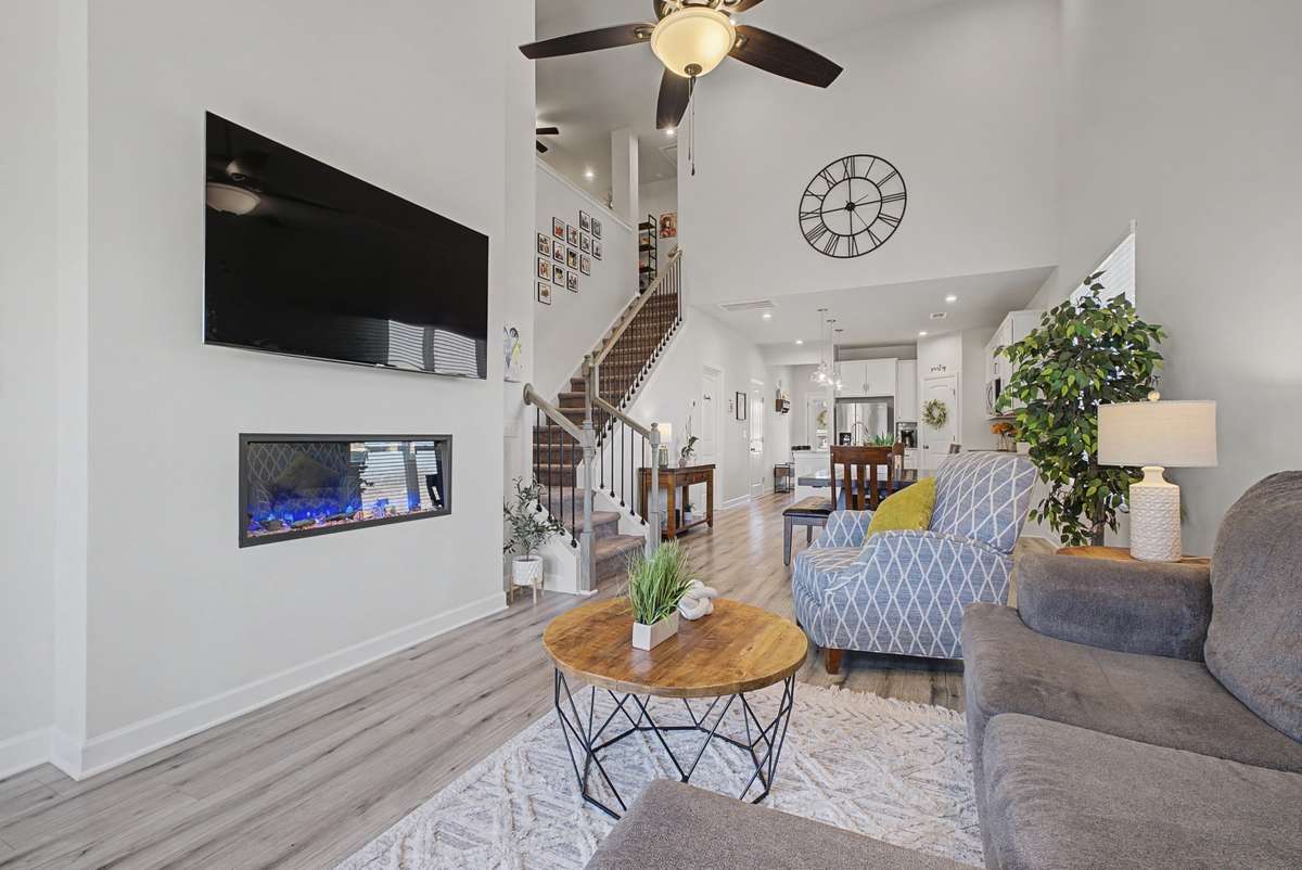 Sleek and sophisticated, this built-in linear fireplace adds a stunning focal point to the living space. Seamlessly recessed into the wall, its elongated design enhances the home’s modern aesthetic. Perfect for cozy evenings.