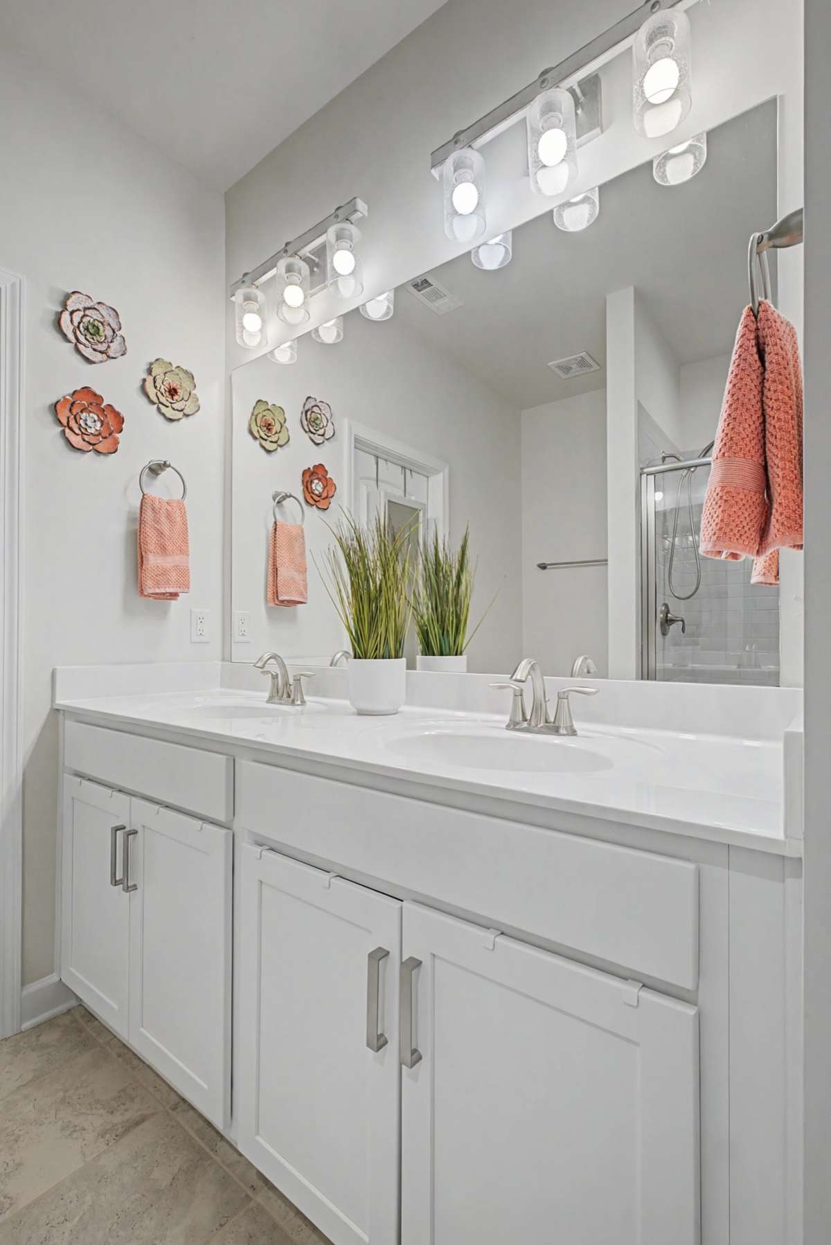 The owners' bathroom has double vanities.