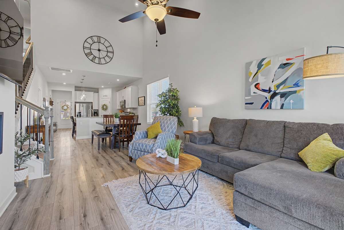 The great room is bright, and welcoming, filled with natural light. Its open concept design creates a seamless flow.  Perfect for gathering with family and friends.