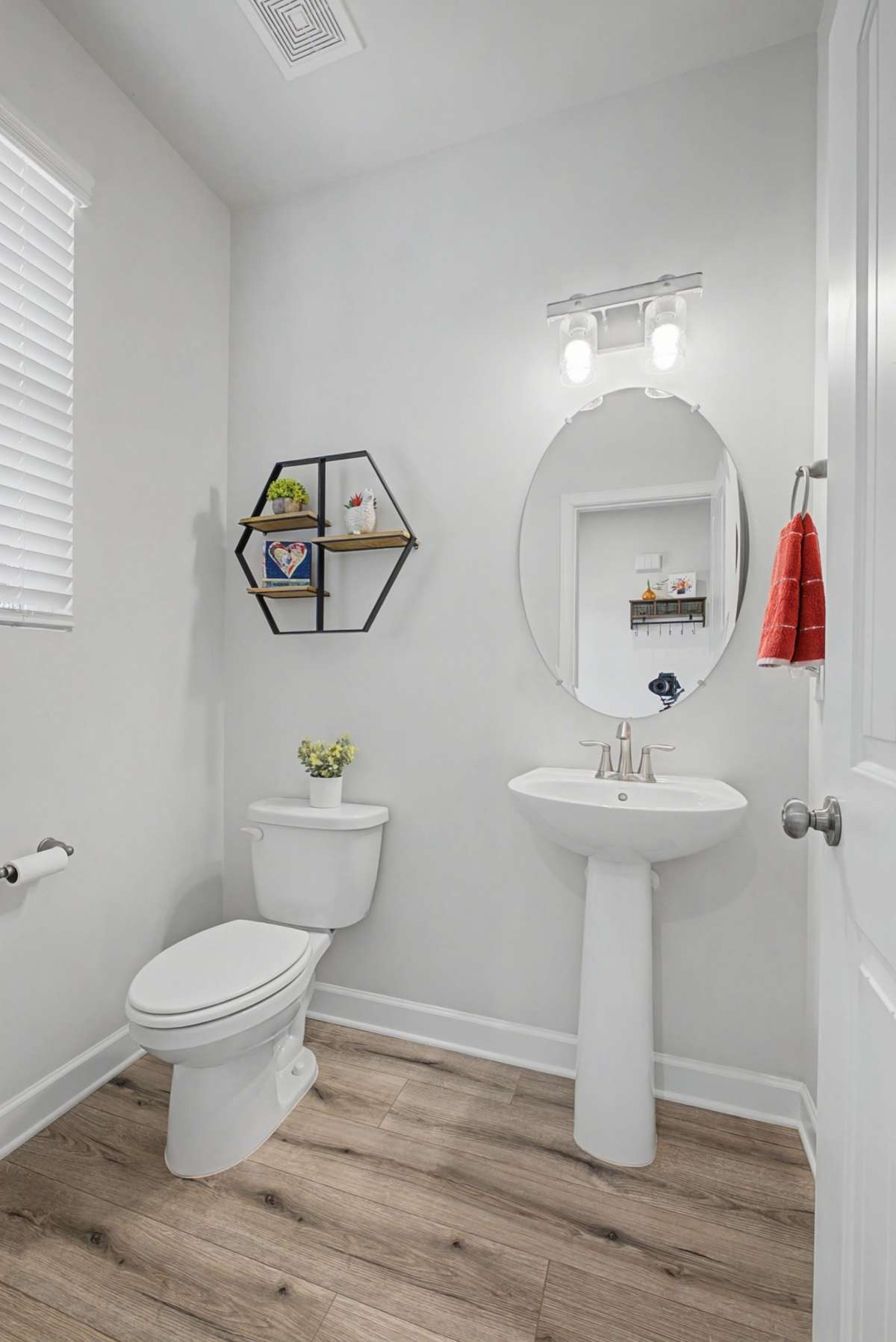 Half bath is conveniently located just before you enter the great room.