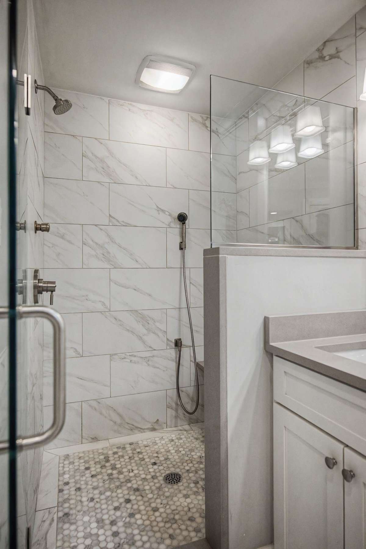 Exceptional shower with seating and multiple shower heads.