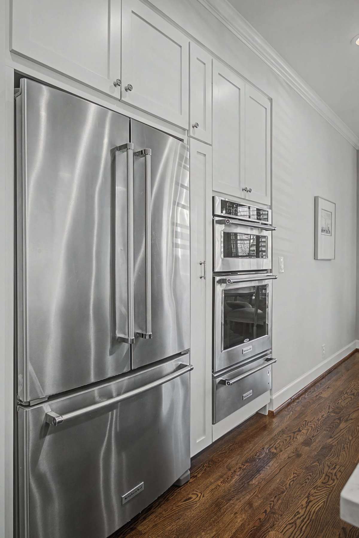 Kitchen Aid appliances. Refrigerator, Microwave, oven and warming drawer.