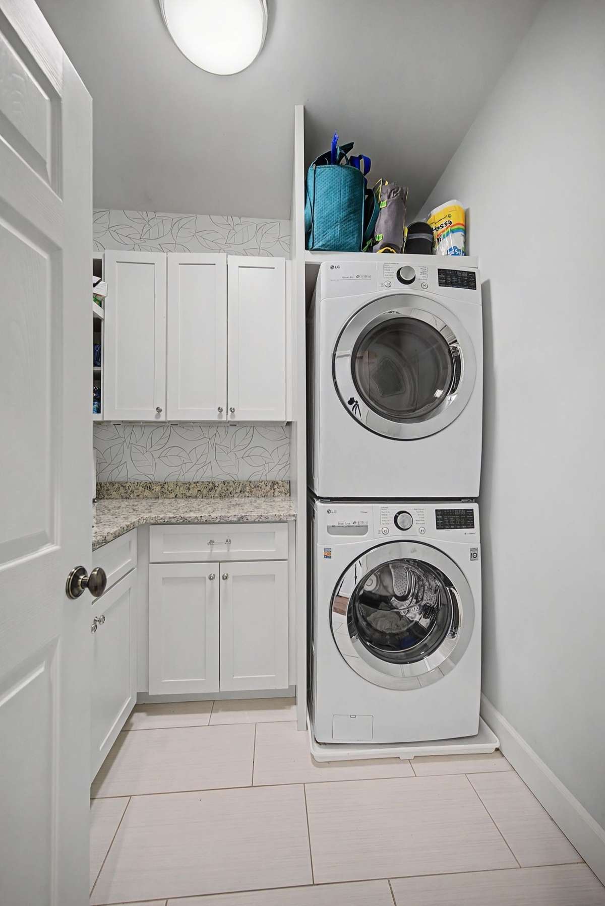 Separate laundry with additional storage.