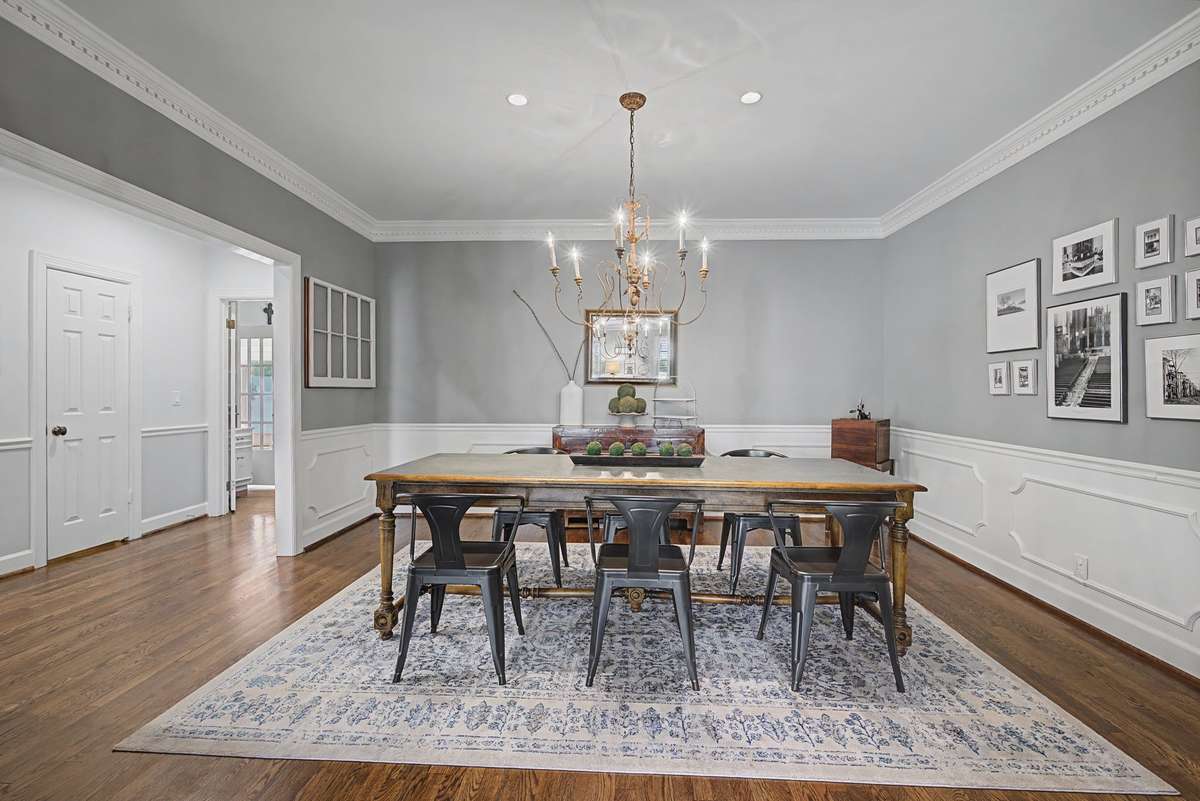 Dining room with wainscoting and crown molding.