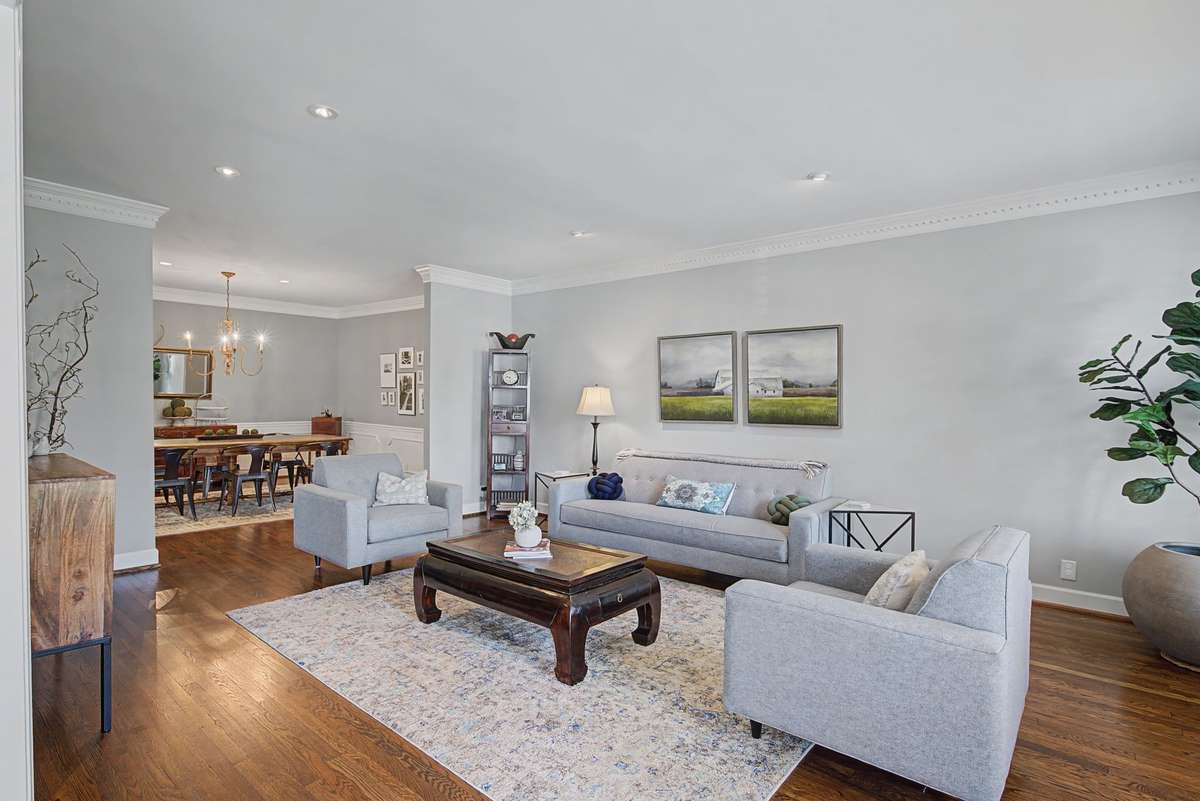 Living room and dining room. Crown moldings and recessed lights.