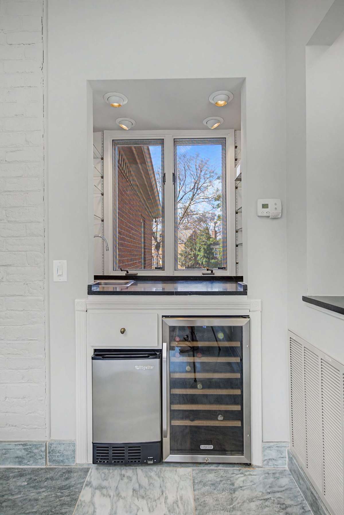Wet bar, ice maker and wine refrigerator.