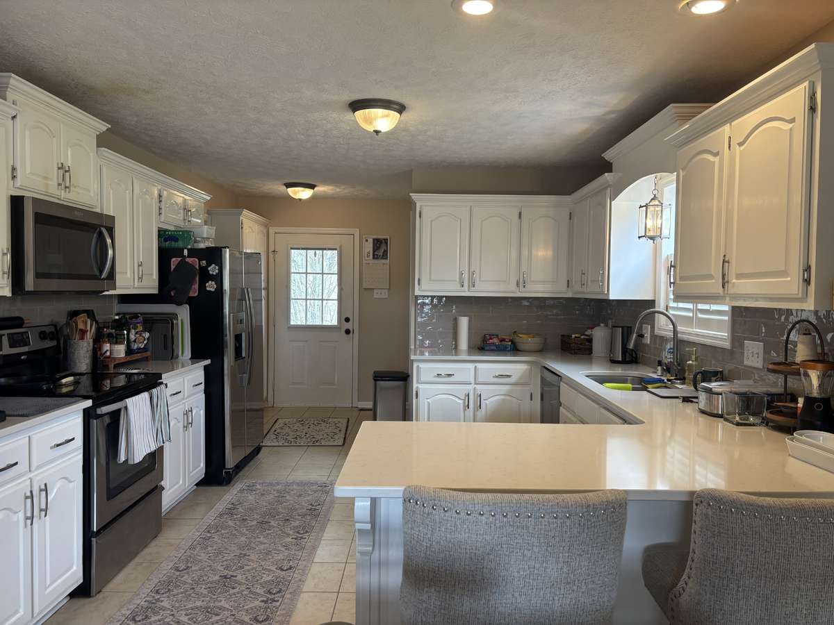 Solid Surface Counters & Gorgeous Backsplash!