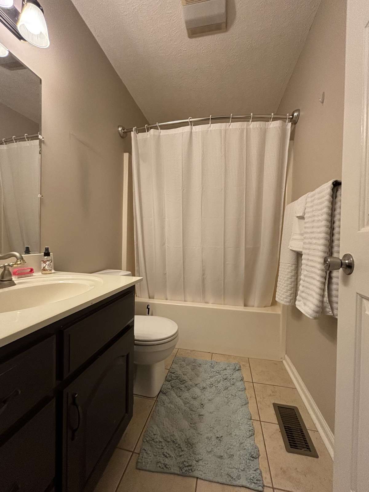 Hall Bath has Tub/Shower Combination and Tile Flooring