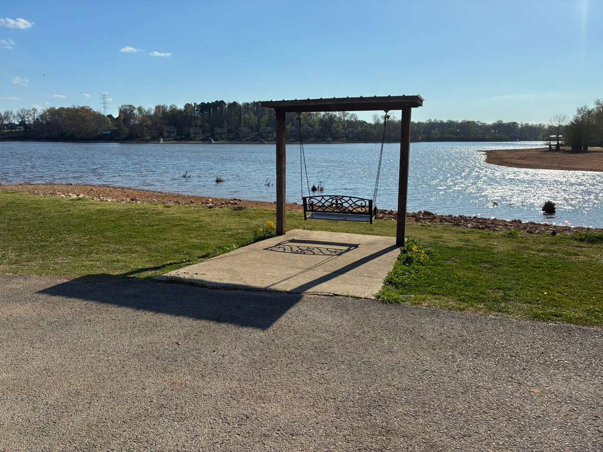 Enjoy a leisure afternoon while viewing the lake at the City Park just across the bridge from your porch.