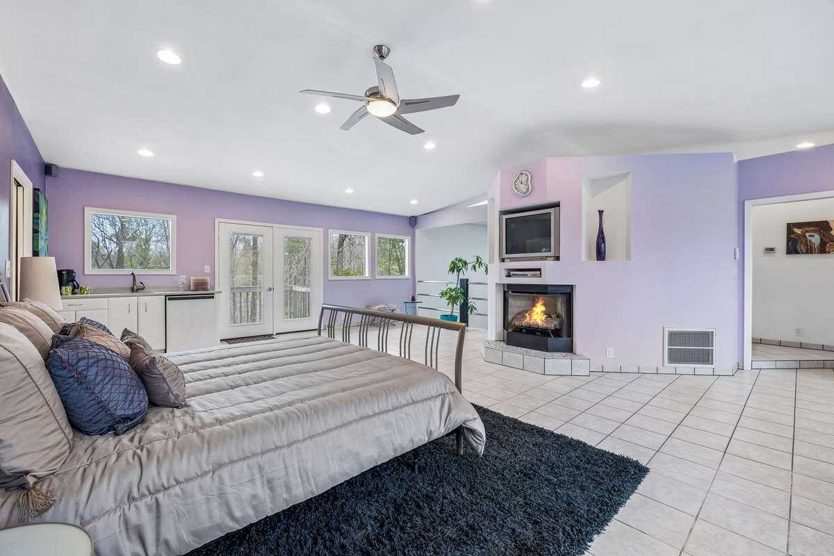 Fireplace & sitting area. Doors lead to Juliet Balcony off bedroom
