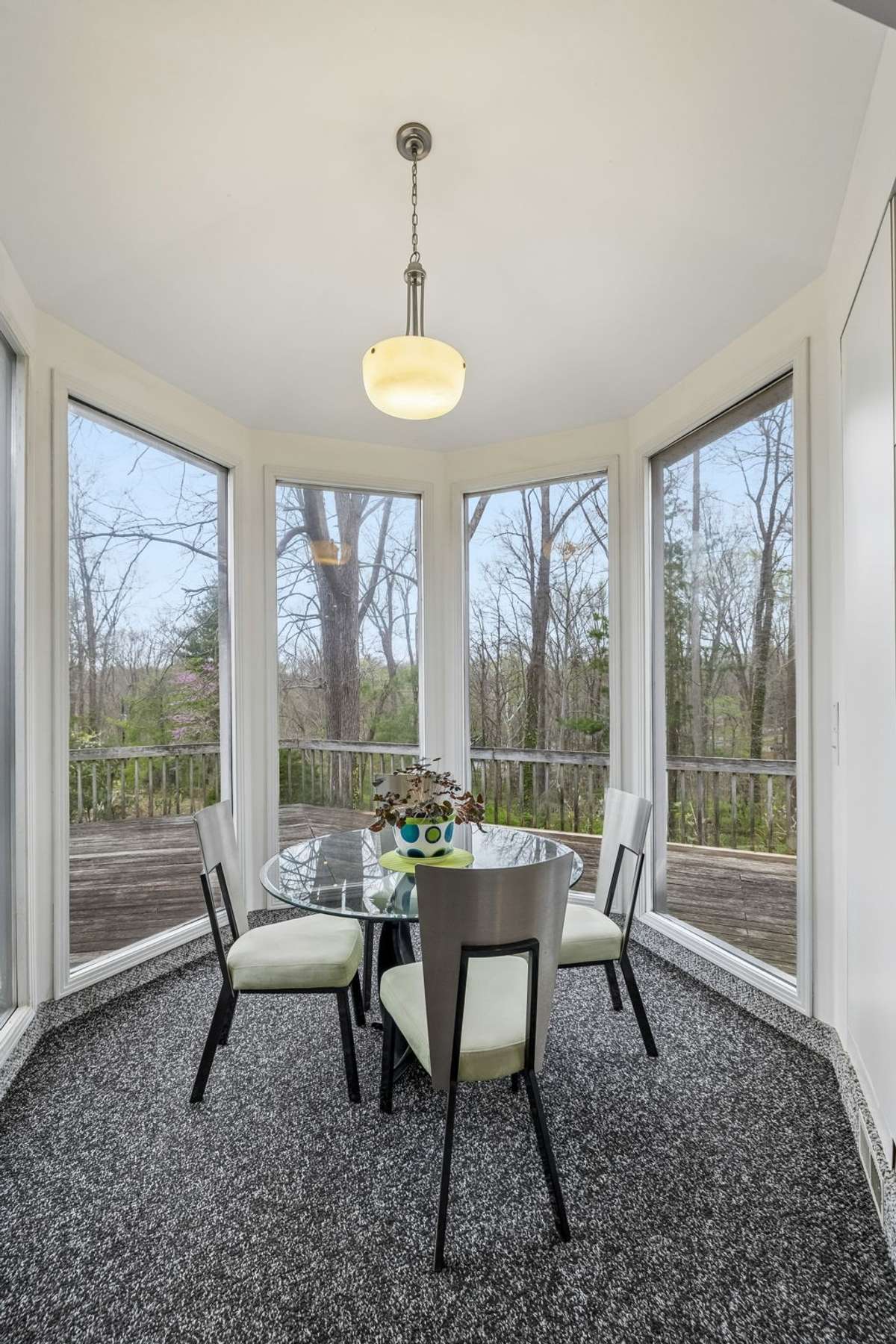 Step down gazebo dining area with panoramic view of the private wooded lot