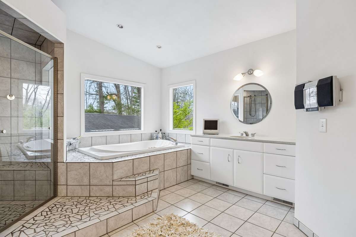 Luxurious Spa inspired  master bath with lots of natural light and temperature controlled heated tile floor.