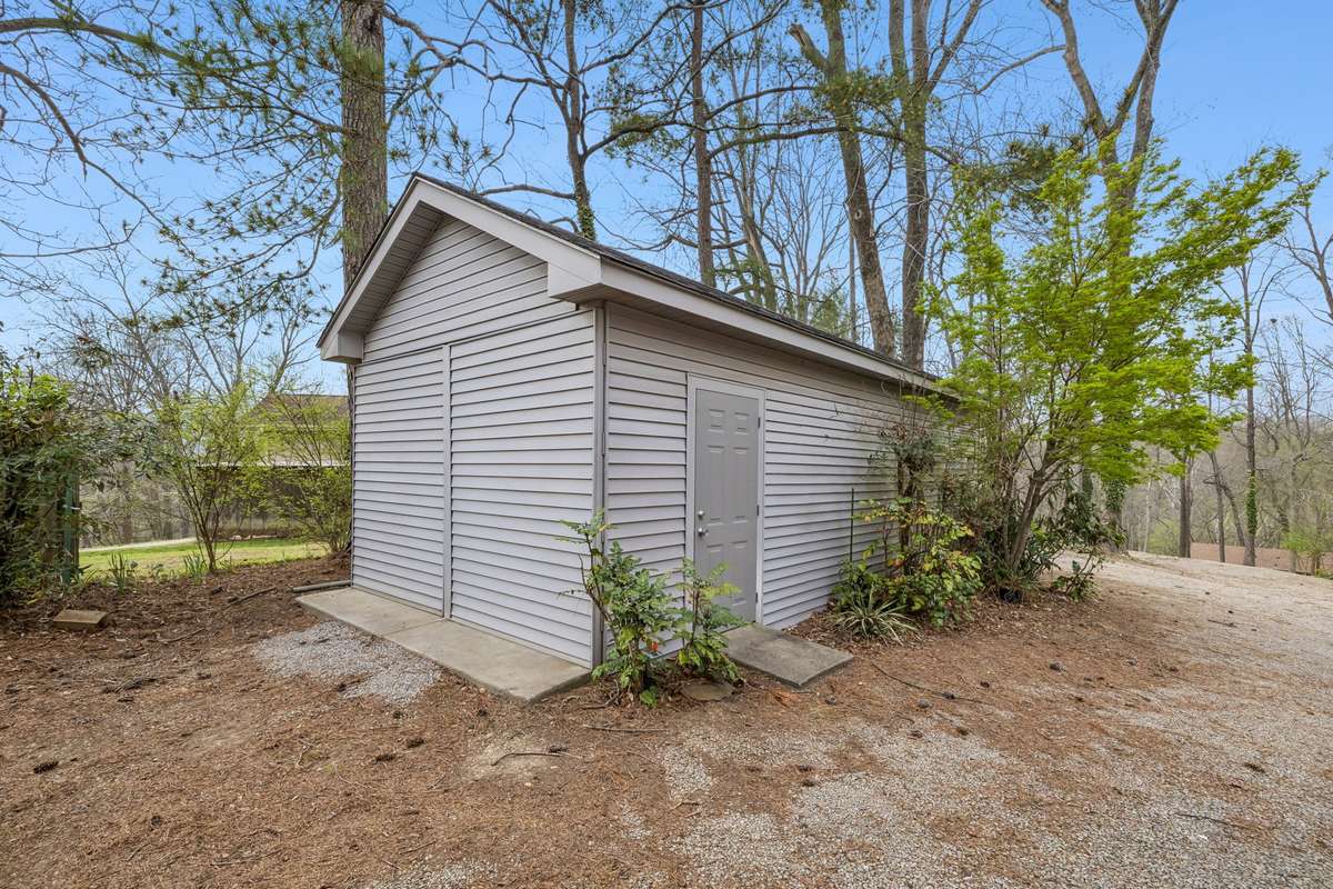 12 x 30 detached garage/shop with concrete floor and electricity. Same vinyl and roofing as house. Separate gravel road from street for easy access to garage & back yard.