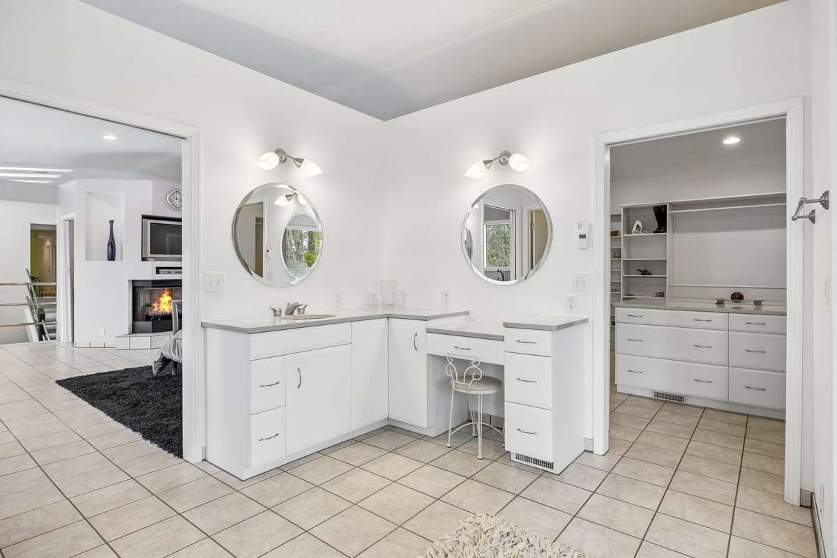 His & her separate sink & vanity areas with silestone countertops