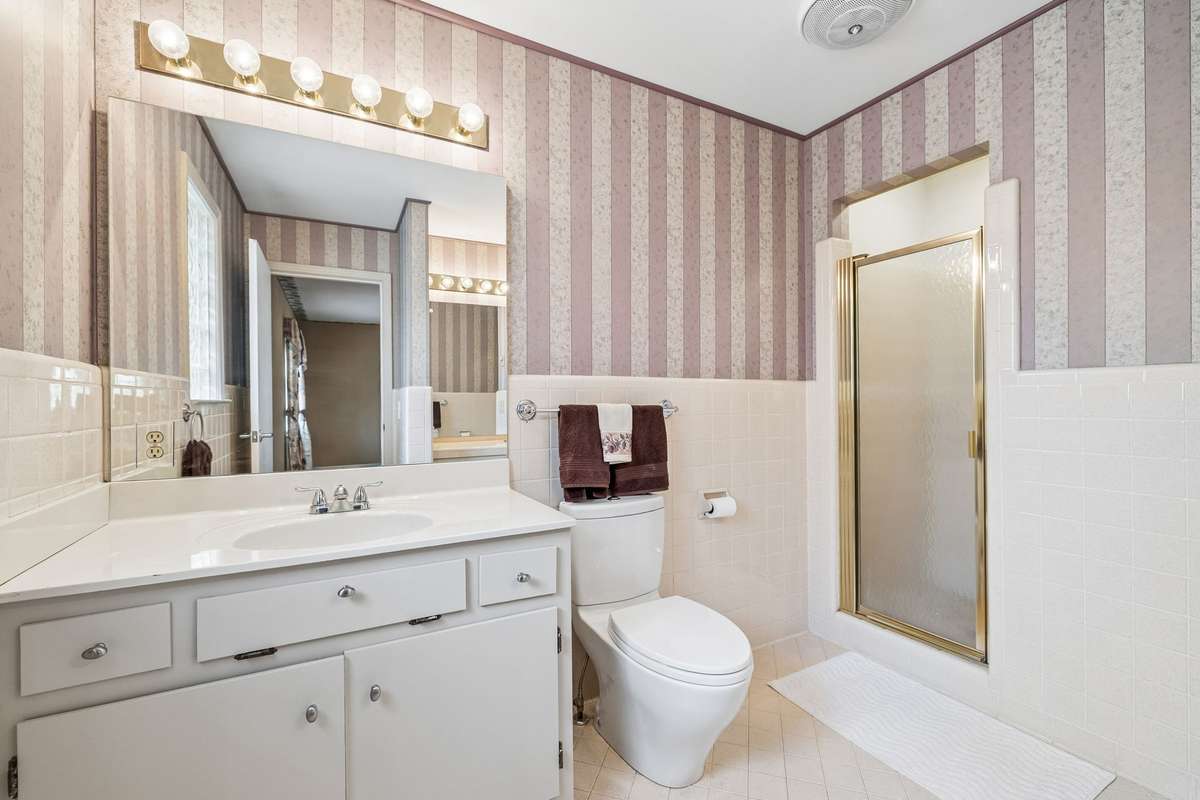 Full bath off additional master suite. Two vanities. Walk in shower.