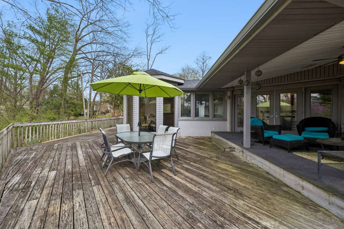 Large wtap around deck extends across back of house