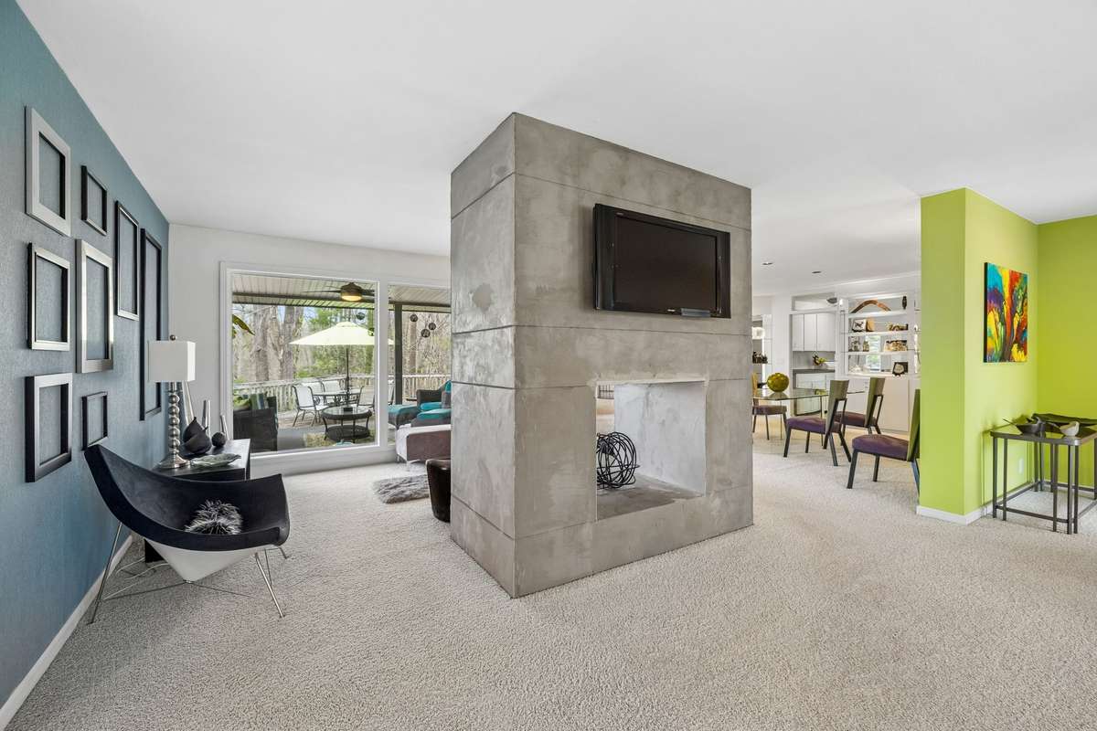 See thru fireplace in center of living, sitting, dining area.