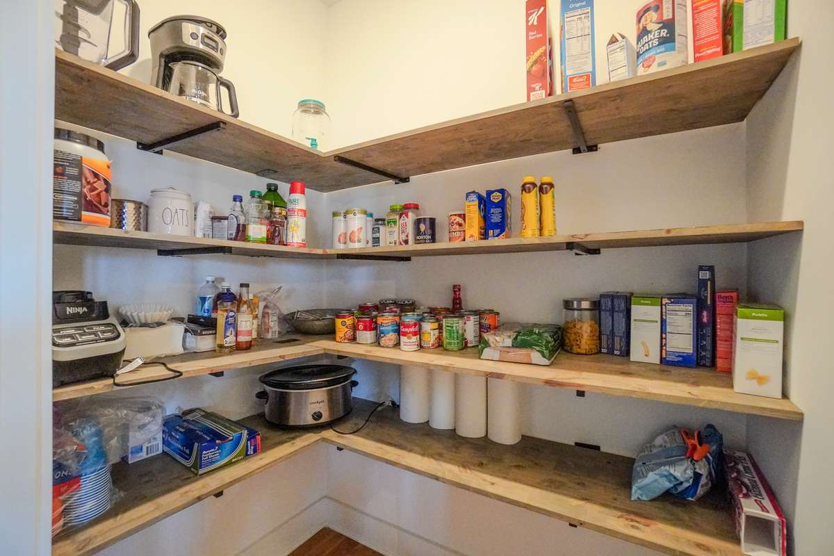 The walk in pantry adds plenty of storage for your small  appliances and canned foods