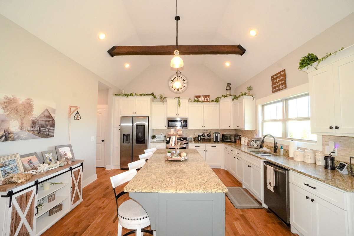 There are Granite countertops and stainless appliances in this spacious and functional kitchen