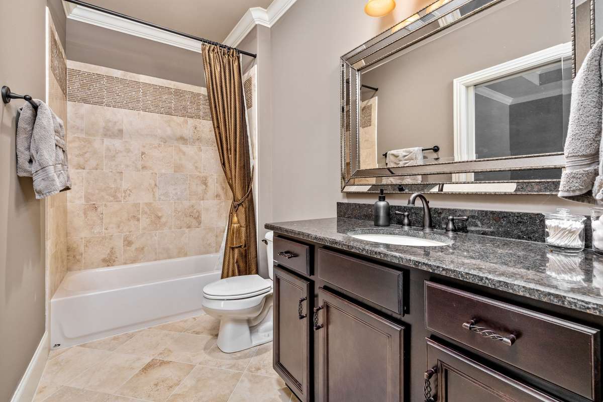 Tiled showers with elegant curtain details