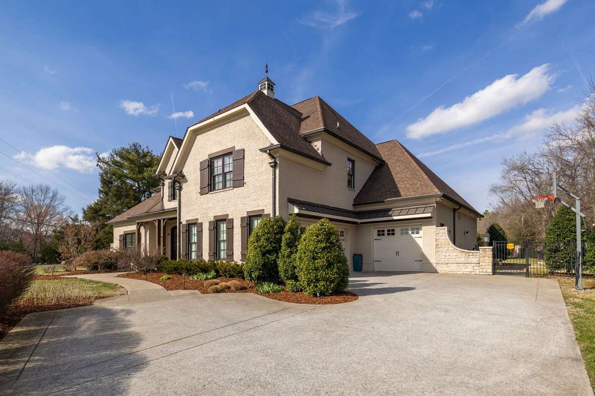 Large driveway, 3 car garage, ample storage and park pad